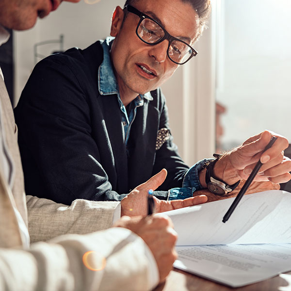 Businessman pointing where client have to sign the contract