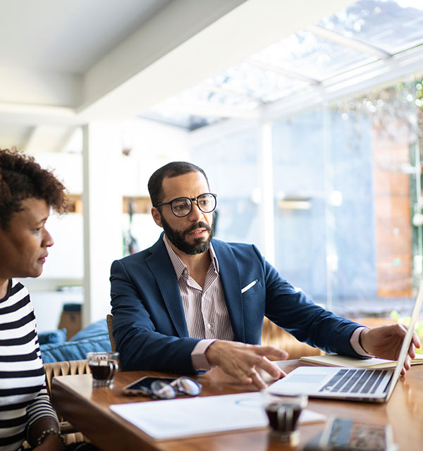 Woman talking to finance advisor at home